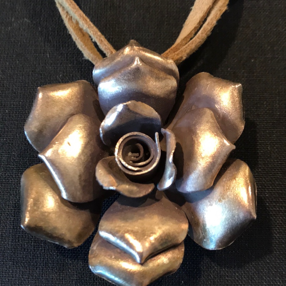 Brass flower pendant.
